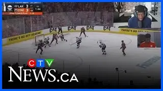Alphonso Davies streams as he watches the Edmonton Oilers play