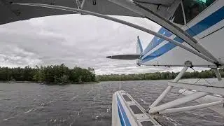 Windy day floatplane landing in a Piper Super Cub looking back!
