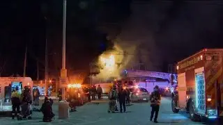 Firefighters lending each other a helping hand
