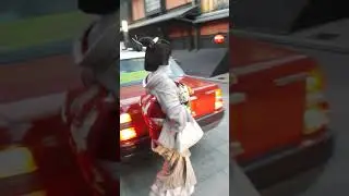 Geisha getting out of a car in Kyoto to be met with another Geisha