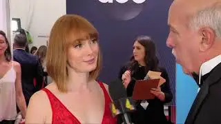 Alicia Witt speaks to Jimmy Carter on the CMA Awards Red Carpet