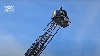 Officials ride on PB's new fire ladder bucket
