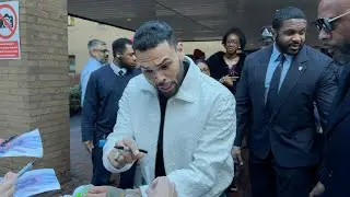 Singer Chris Brown leaves court, signs autographs after assault case hearing | AFP