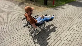 Boy on wheelchair with two legs in cast, llc and slc