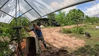 Getting Clay and Black dirt to the raised bed on dragon fruit alley!