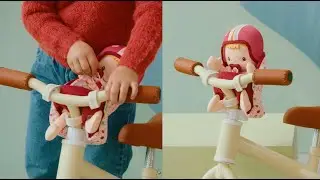 LILLIPUTIENS Lalka dzidziuś w foteliku rowerowym Lena