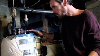 heating water with hitzer wood burner , hot water tank