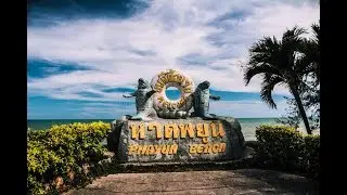 Walking on the beach of Phayun Beach, Ban Chang touring the Buddhist Temple