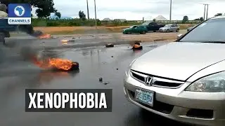 Protesters Burn Tyres As Police Prevent Attack On Shoprite In Abuja