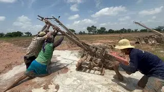គោយន្តភ្ជួរដីស្រែ  ជាប់ផុង  A small Kubota tractor plows rice fields during the rainy season.