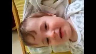 Samuel messing while having his nappy changed
