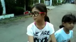 Three amazing kids (seing  a sabarian husky)