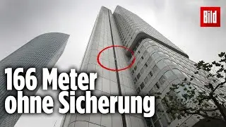 Spiderman Alain Robert klettert auf Deutsche-Bahn-Tower in Frankfurt