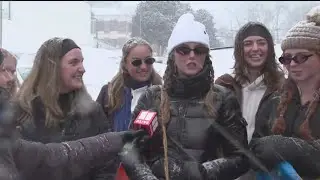Snow falls in Athens as students enjoy day by sledding down hills