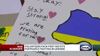 Volunteers pack first-aid kits for people fighting in Ukraine