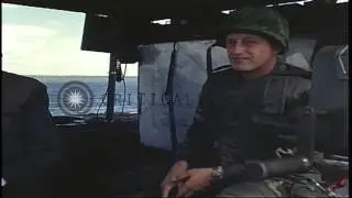Men aboard the LCM and SEAL boat talk on radio phones and plan the strategies in ...HD Stock Footage
