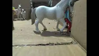Stop motion of (#schleich) Emma (the rider) unloading the horse trailer.