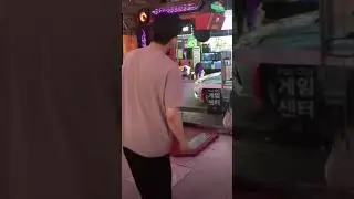 Korean doing a 720 kick on punching machine