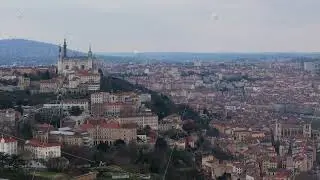 Lyon cityscape revealing Fourviere basilica perched dramatically on elevated terrain, showcasing