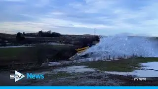 Rail plough smashes through snow to clear tracks