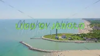 Inscription on video. Italy, Jesolo. Light House Faro di Piave Vecchia. Lido di Jesolo, is the beach