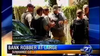 Live Oak Bank robber at large