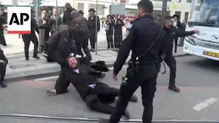 Jerusalem police drag ultra-Orthodox Jewish men protesting military enlistment