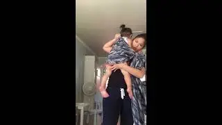 Traditional sling carry using a long wrap (base-1)