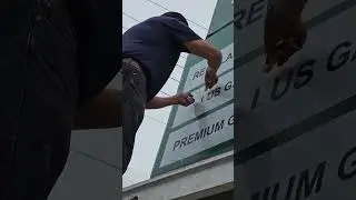 Working, replacing graphics on a pole sign at a gas station in panorama city  #signs #printing