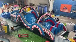 Candy Twist Inflatable Obstacle Course: Red-White Stripe Fun for All!