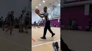 Referee catches Basketball but reversed