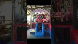 E102013 Inflatable Justice League Bounce House with a slide，Preferred Inflatable Supplier
