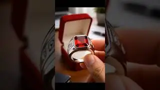 Ruby red stone ring with silver ring with diamond motif adds to the luxury of this ring.