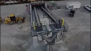 Two Static Conveyors Combine With A Telescopic Stacker To Unload Train