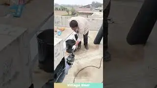 Workers spread hot melted asphalt on roof for waterproofing! #roofing #construction