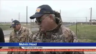 Picketers walk in cold temperatures