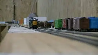 Two HO scale SD40-2 athearns pull long intermodal train
