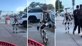 Rise of the machines...cowboy robot alongside a muscle sensor robot.