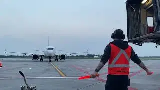 Marshalling in Boeing 737 Max 8 onto Gate at Airport