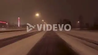 POV shot driving along a snow covered highway in Helsinki, Finland