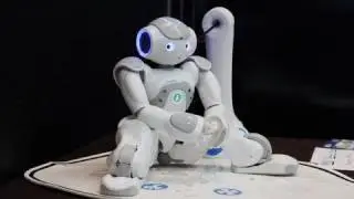 Aldebaran's NAO Robot with its new Developper only prototype of Charging Station