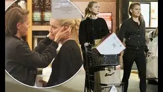 Amber Heard and girlfriend Bianca Butti share a tender moment while stocking up on groceries