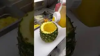 Tropical cocktail fresh juice in a pineapple for summer time on a beach or not