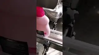 Two faces labeling machine for big detergent bottles