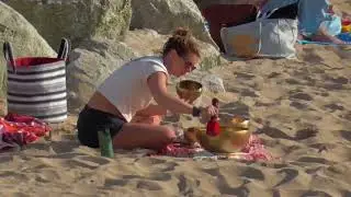 Singing bowl sundowner at Fistral Beach, Cornwall, UK