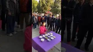 Bowls Can Be Instruments Too-The Street Performance by a Chinese Little Girl
