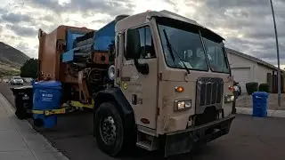 Garbage trucks packing post Christmas trash