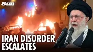 IRAN DISORDER: Angry protesters set fire to vehicles as thousands march against the country's rulers