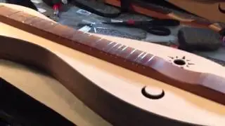Beede dulcimer near completion. 4 string walnut/spruce...