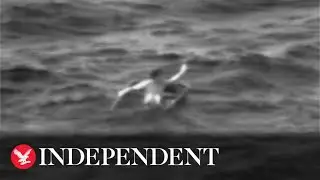 Moment coast guard rescue man from partially sunken fishing boat after 35 hours at sea